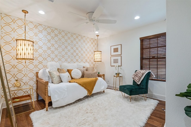 bedroom featuring ceiling fan and dark wood-type flooring