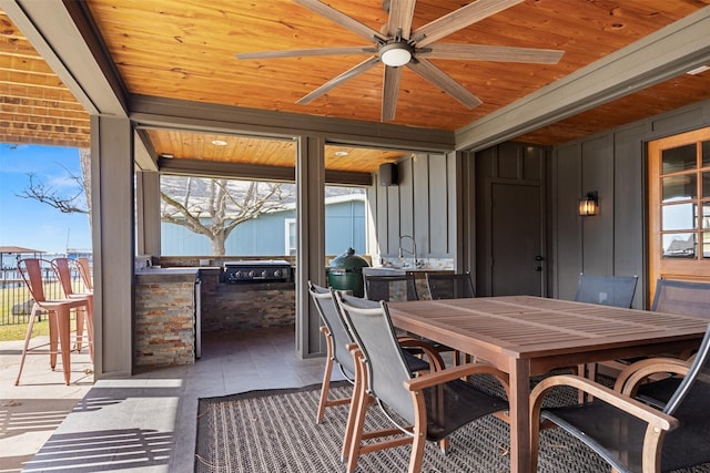 sunroom / solarium with ceiling fan and wooden ceiling