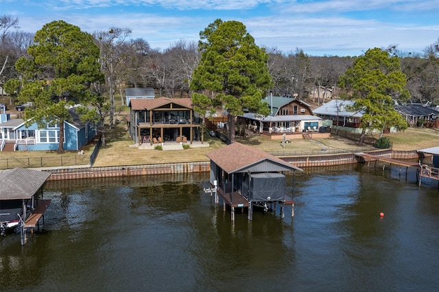 dock area featuring a yard and a water view