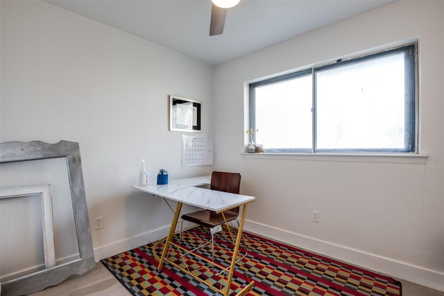 office space with a wealth of natural light and ceiling fan