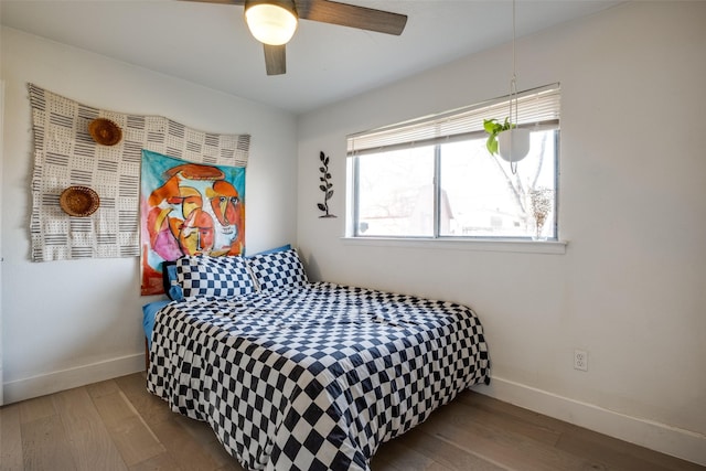 bedroom featuring ceiling fan and hardwood / wood-style floors