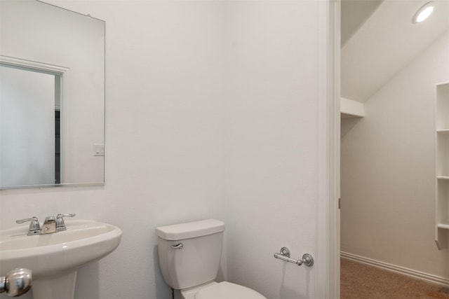 bathroom featuring toilet and sink