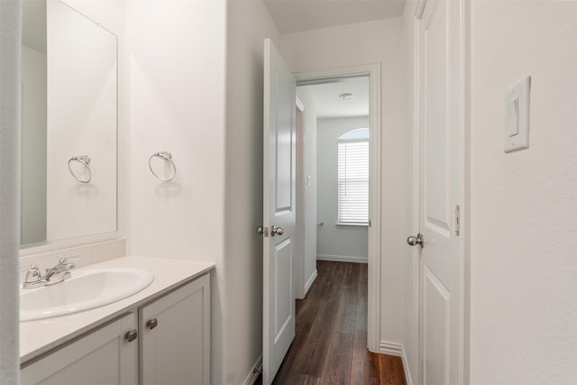 bathroom with hardwood / wood-style floors and vanity