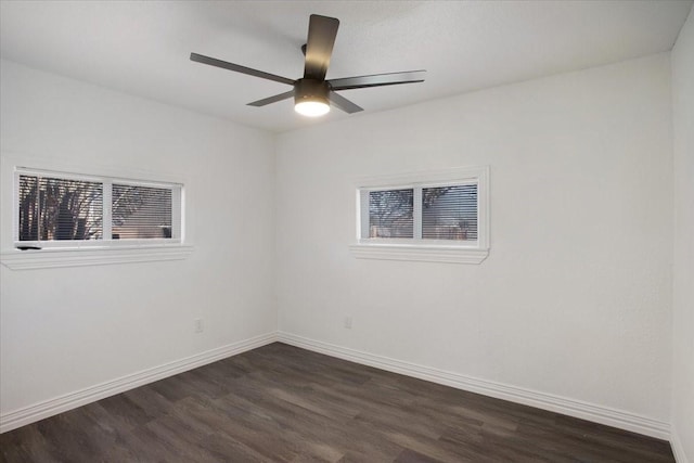 unfurnished room featuring ceiling fan and dark hardwood / wood-style floors