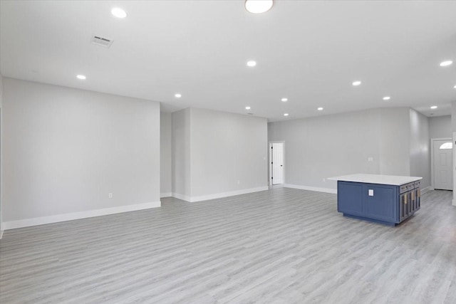 unfurnished living room with light hardwood / wood-style floors