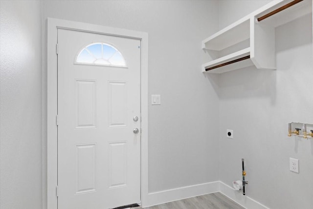 laundry room with gas dryer hookup, washer hookup, hookup for an electric dryer, and light hardwood / wood-style flooring