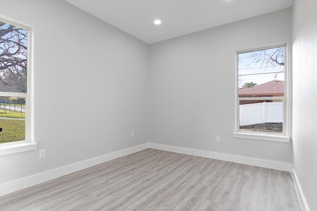 spare room featuring light hardwood / wood-style flooring