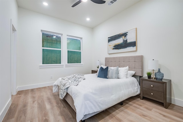 bedroom with light wood-type flooring and ceiling fan