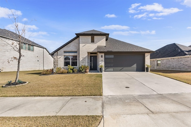 view of front of house with a garage and a front yard