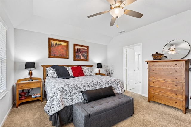 bedroom featuring light colored carpet, vaulted ceiling, and ceiling fan