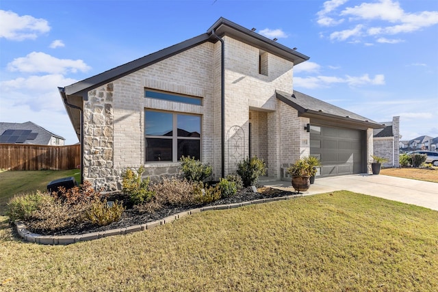 view of side of property with a yard and a garage