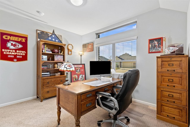 carpeted office space with lofted ceiling