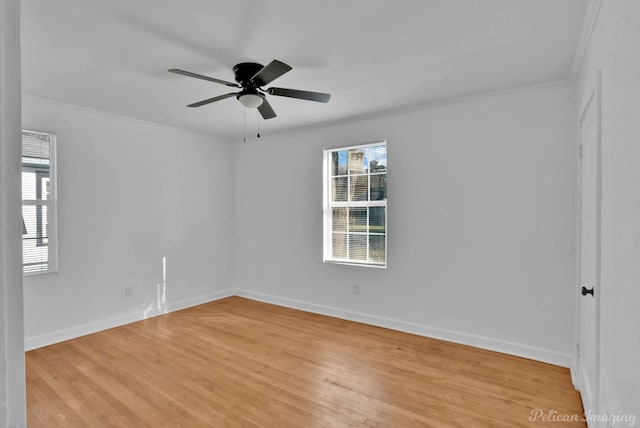 spare room featuring ceiling fan, ornamental molding, and light hardwood / wood-style flooring