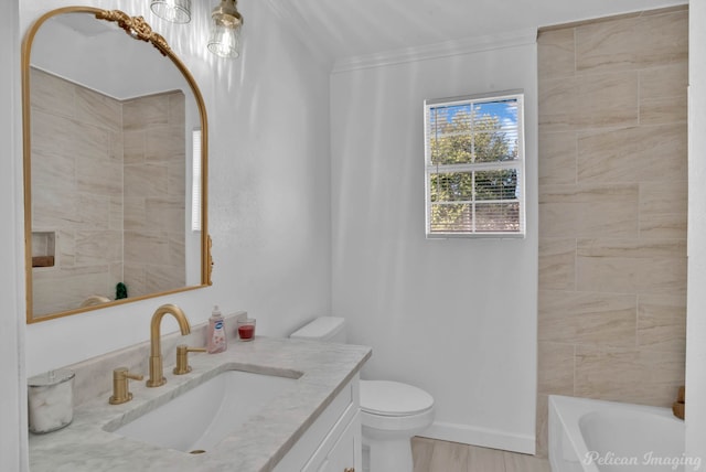 bathroom with toilet, wood-type flooring, ornamental molding, vanity, and a tub