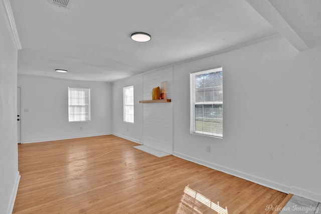 empty room with light hardwood / wood-style floors