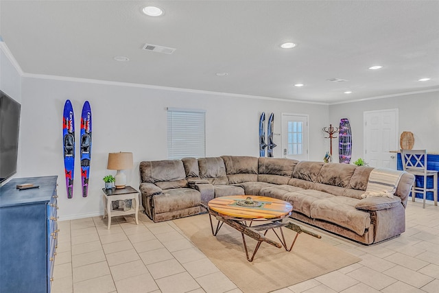 living room featuring ornamental molding and light tile patterned floors