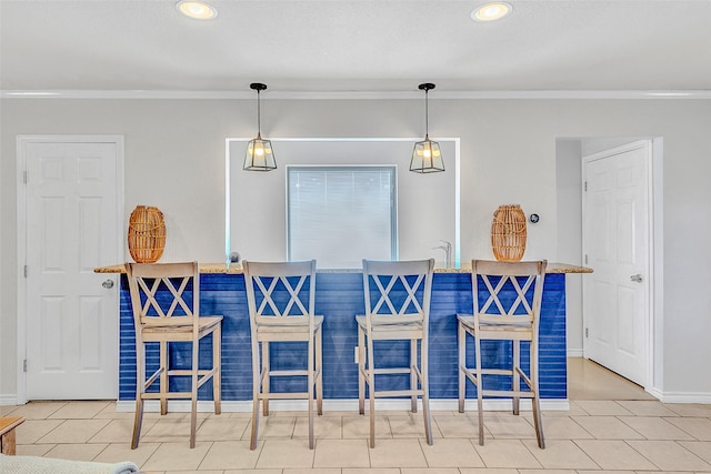 tiled dining room with crown molding