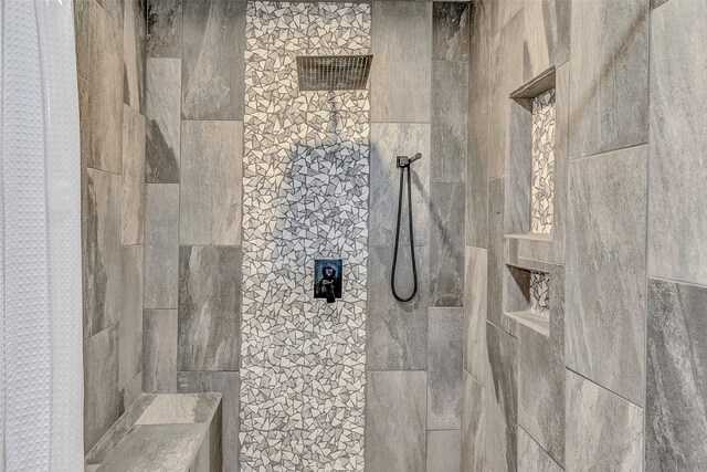 bathroom with tiled shower