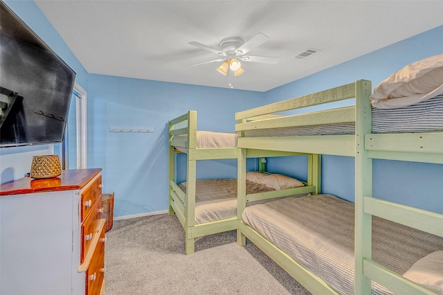 bedroom featuring light carpet and ceiling fan