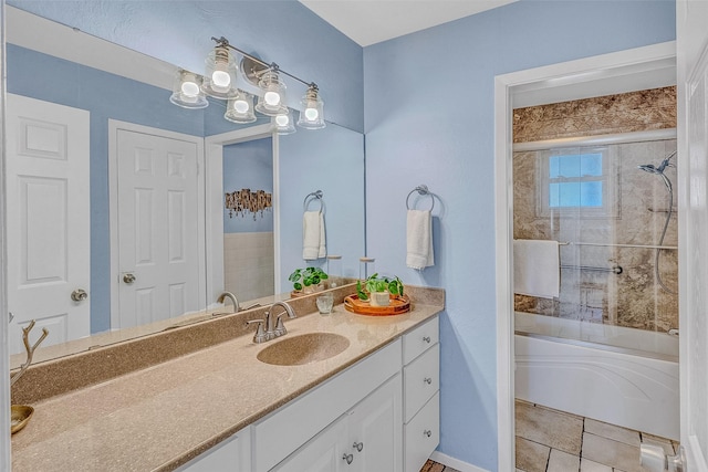 bathroom with vanity and bath / shower combo with glass door