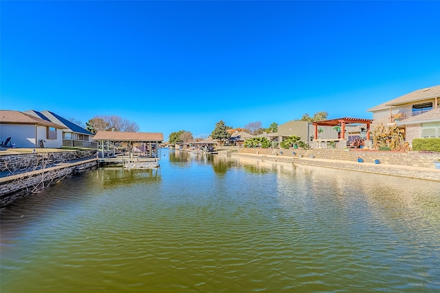 view of dock with a pergola and a water view