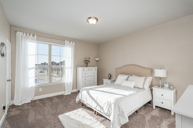 carpeted bedroom with baseboards