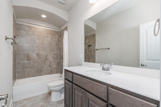 full bath with toilet, shower / tub combo, visible vents, and vanity