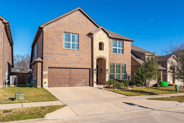 traditional-style home with driveway, brick siding, stone siding, and cooling unit