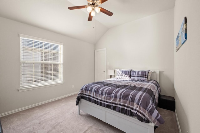 bedroom with carpet floors, vaulted ceiling, and ceiling fan