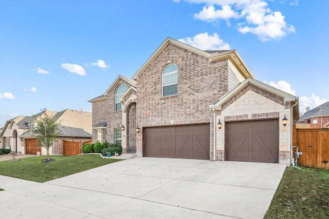 view of front of property with a garage and a front yard