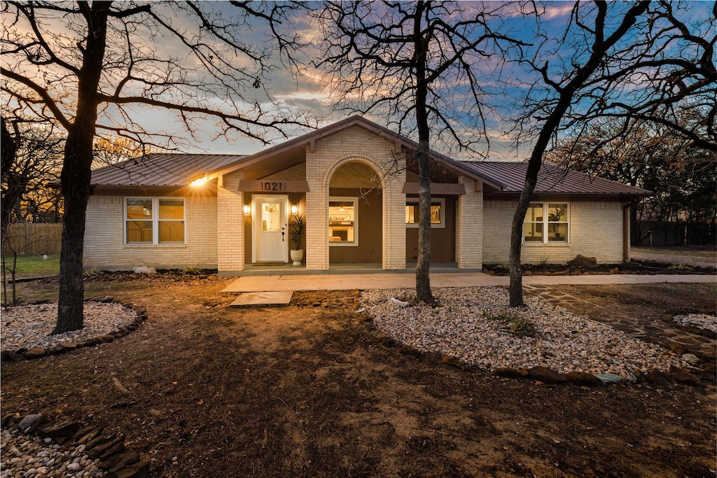 ranch-style home with a patio