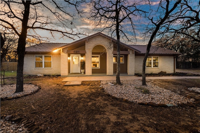 ranch-style home with a patio