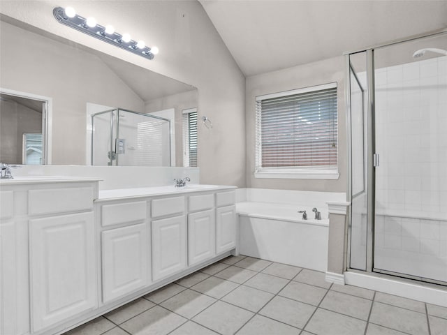 bathroom with vanity, tile patterned flooring, and plus walk in shower