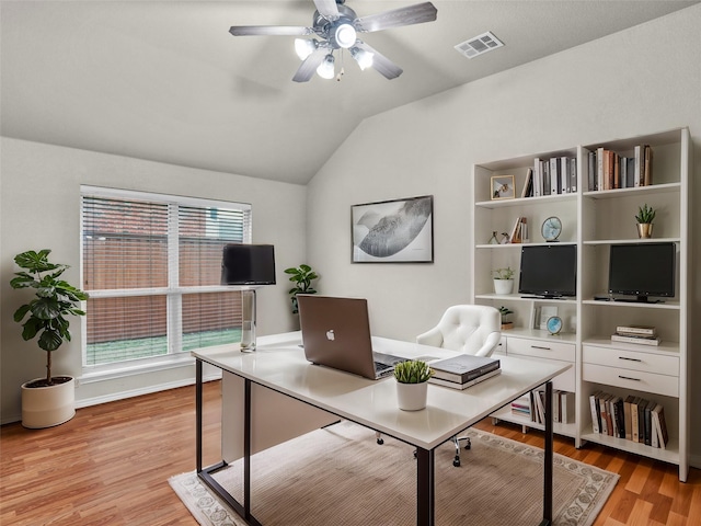 office area featuring ceiling fan, light hardwood / wood-style flooring, and lofted ceiling