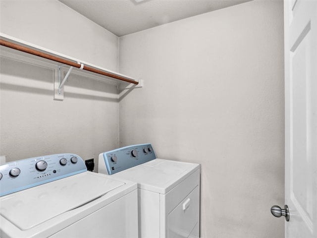 laundry room with washer and clothes dryer