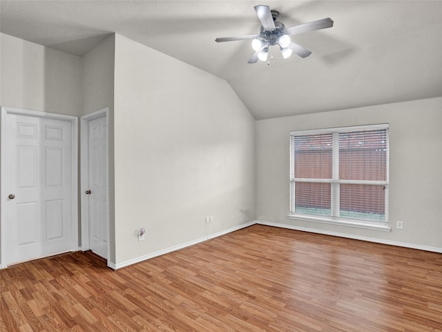 bonus room with light wood-type flooring, ceiling fan, and lofted ceiling