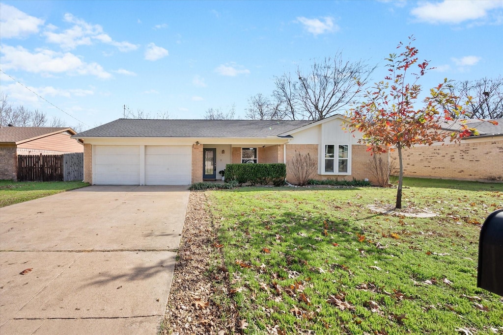 single story home featuring a front yard and a garage