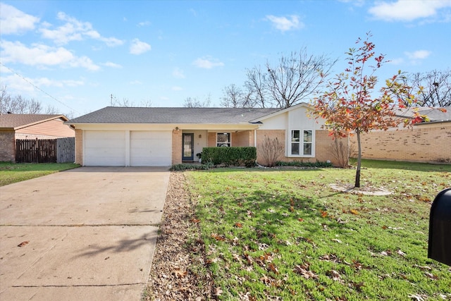 single story home featuring a front yard and a garage