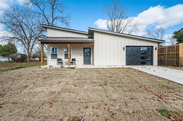 view of front of property featuring a porch and a garage