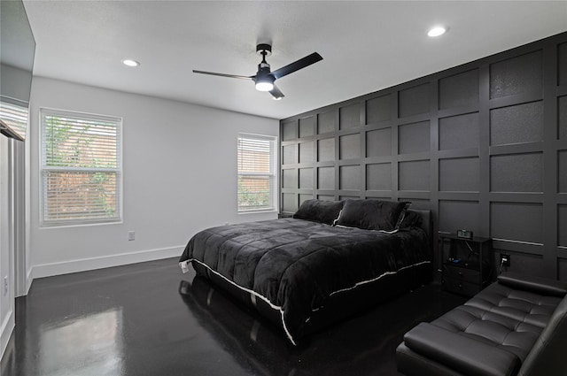 bedroom with multiple windows and ceiling fan