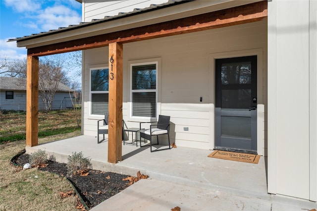 property entrance with covered porch