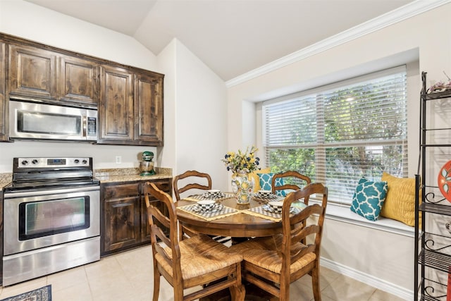 kitchen with appliances with stainless steel finishes, dark brown cabinetry, stone countertops, and lofted ceiling