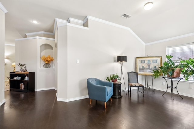 living area with dark hardwood / wood-style flooring, vaulted ceiling, and ornamental molding