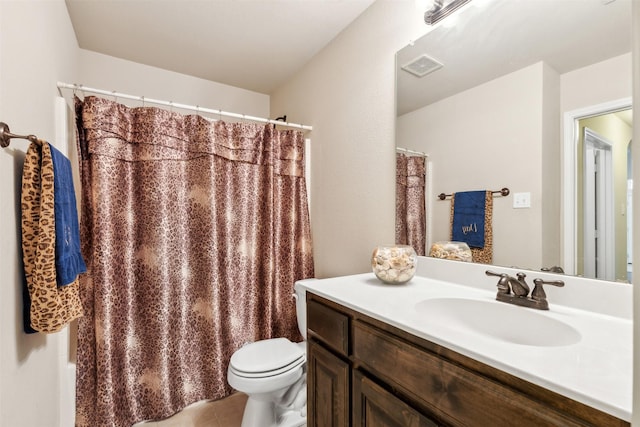 bathroom with tile patterned floors, vanity, and toilet