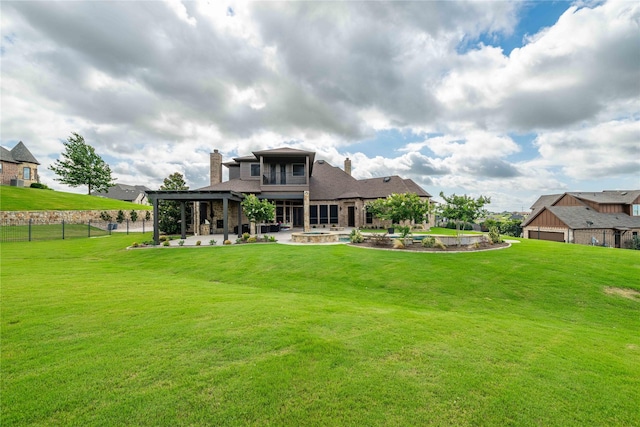 back of property featuring a patio and a lawn