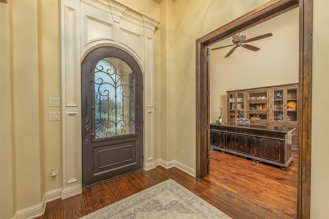 entryway with ceiling fan and dark hardwood / wood-style flooring