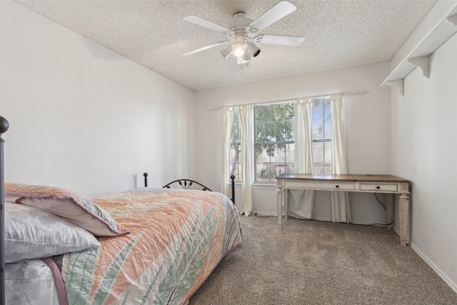 bedroom with carpet, a textured ceiling, and ceiling fan