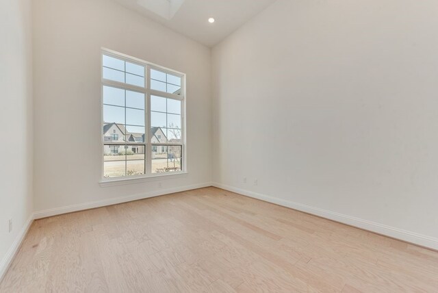 empty room with light hardwood / wood-style floors