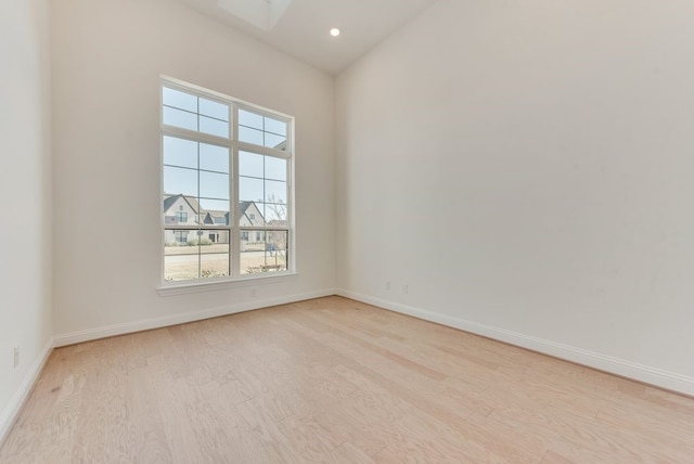 unfurnished room with light hardwood / wood-style flooring