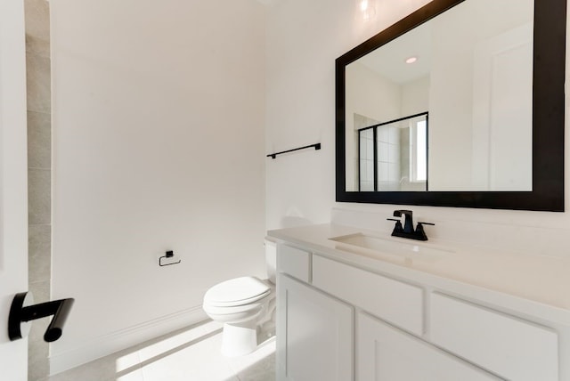 bathroom featuring vanity, tile patterned floors, toilet, and walk in shower